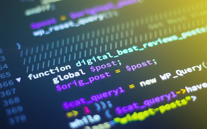 Developer comparing AI model outputs side by side on multiple screens